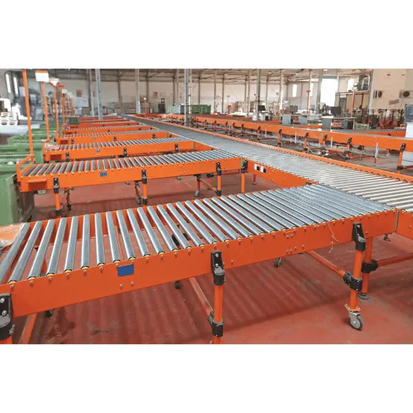 Medium-duty galvanized gravity roller conveyor straight section installed in warehouse environment for industrial material handling