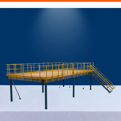Clear span mezzanine floor system with steel platform, safety railings, and stairs for warehouse storage.
