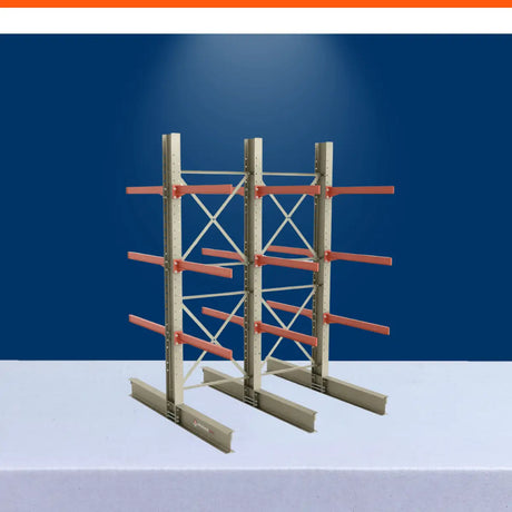 Double-sided cantilever racking system with steel frames and orange arms for industrial warehouse storage.