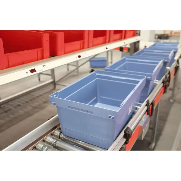 Accumulation conveyors lifestyle image with carton industrial zero pressure material handling system for controlled package flow and accumulation
