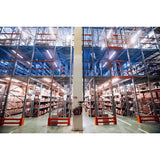 Pallet rack supported mezzanine lifestyle view showing industrial warehouse storage system in real working environment

