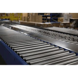 Medium-duty galvanized gravity roller conveyor straight section in industrial warehouse setting for material handling applications
